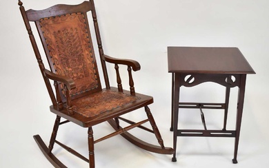 An American red walnut rocking chair upholstered with tooled leather...