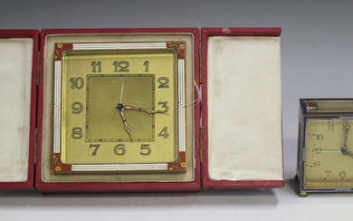 An Art Deco gilt metal and enamelled bedside alarm clock, the gilt dial with Arabic hour numerals, t