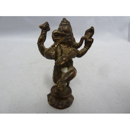 An Indian miniature bronze temple figure of ganesh on circul...