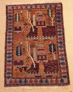 An Unusual Tabriz/ Kerman or South Persian Carpet woven with a garden of trees and temples in a decorative border, possibly the 'Tree of Life'. 37 in x 54 in (94 cm x 137 cm).