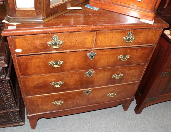 An early 18th century walnut and feather-banded five drawer chest,...