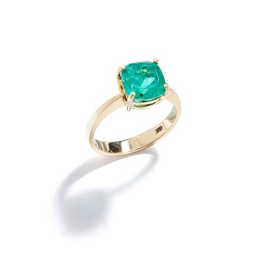 An emerald single-stone ring