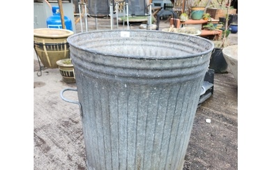 An old galvanised twin handled dustbin