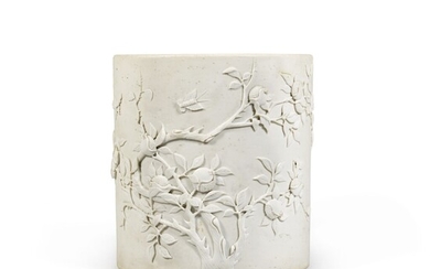 An unglazed moulded and carved biscuit porcelain brushpot Late Qing dynasty | 清末 素胎雕瓷石榴紋筆筒