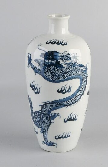 Chinese white porcelain vase with blue dragons.