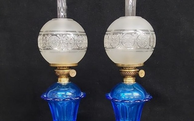 Circa 1860's Sandwich Cobalt Blue pair of Oil Lamps with P & A Victor burners with antique shades.