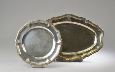 Two dishes with a silver bent edge. One circular with...