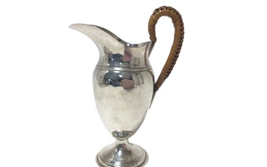 Edwardian silver hot water jug with wicker covered handle