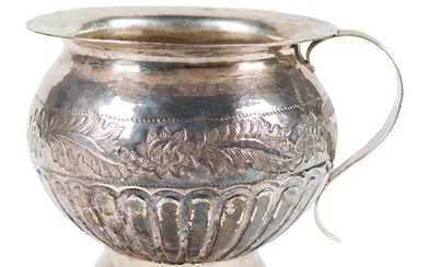 Embossed silver spittoon. Novohispanic or Viceregal work. Mexico or Peru. Late 18th century.