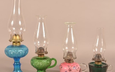 Four Antique Colored Glass Fluid Lamps.