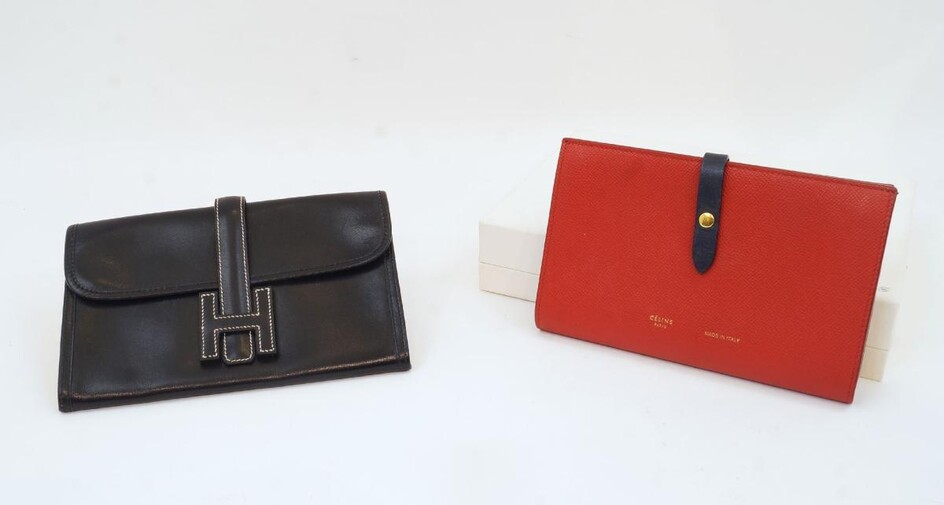 Hermes: a Jige black leather clutch, bearing date stamp A within a square for 1997, with cream stitching and leather strap 'H' flap closure, single compartment interior, gilded logo with 'Made in France' to exterior under flap, together with a...