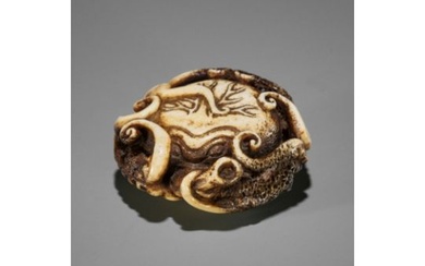 ISSHIN: A SUPERB STAG ANTLER NETSUKE OF AN ENTANGLED OCTOPUS