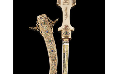 Kumiya, typically Moroccan 18 Kt gold ceremonial knife with avoriolina handle, enriched with diamond borders and emerald cabochon. Probably made...