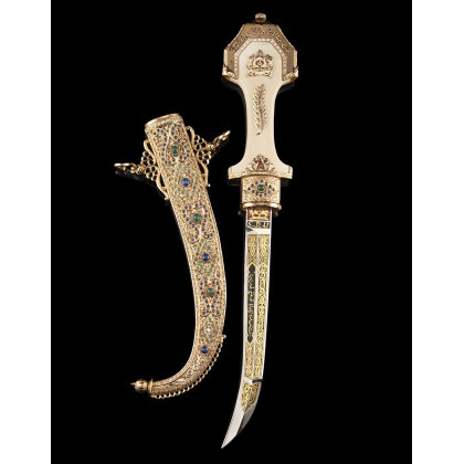 Kumiya, typically Moroccan 18 Kt gold ceremonial knife with avoriolina handle, enriched with diamond borders and emerald cabochon. Probably made...