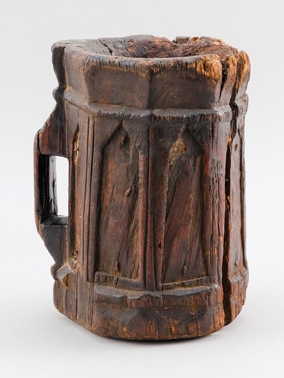LATE GOTHIC CARVED OAK TANKARD With seven archways in relief and a rectangular handle. Unmarked. Height 8.5".