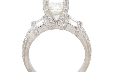 Lady's 18K White Gold Diamond Dinner Ring, with a central 1.01 carat round diamond, within a tiny