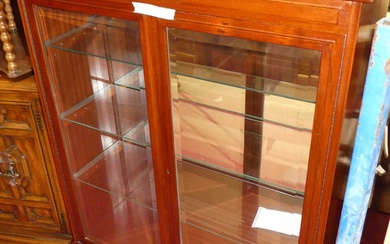Lot details A contemporary mahogany double bevelled glass display cabinet,...