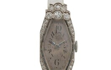 Montre bracelet de dame en or gris 18K (750/°°), boitier losange stylisé réhaussé de roses,...