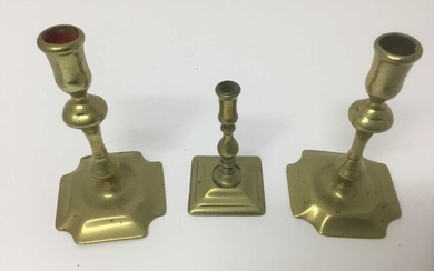 Pair of early 18th century brass squat candlesticks, together with a similar taperstick