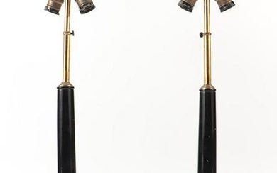 Pair of ebonized Empire style table lamps having bronze mounts and a leather wrapped base C 1945.