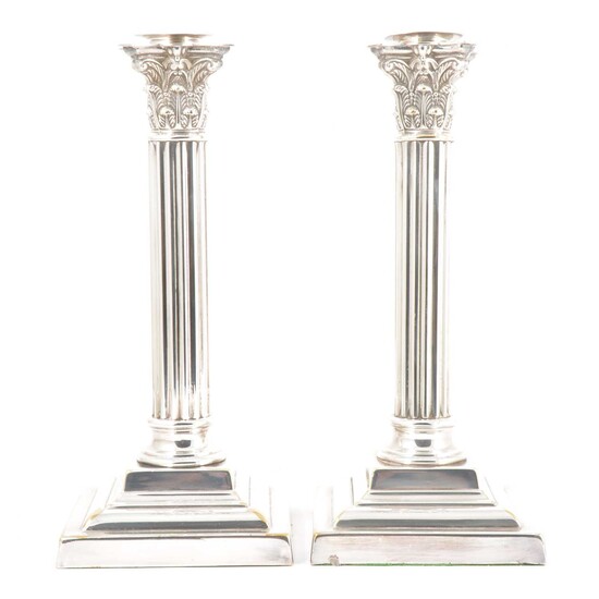 Pair of silver plated Corinthian column candlesticks, etc