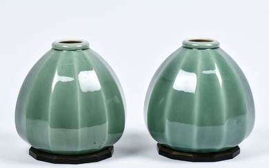 Paul MILLET (1870-1950) à Sèvres. Paire de vases en céramique couleur céladon à douze pans...