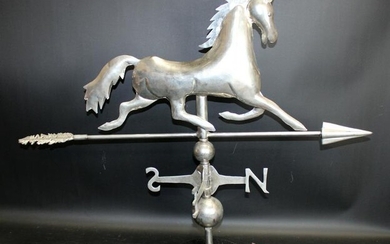 Polished chrome horse weather vane on marble base