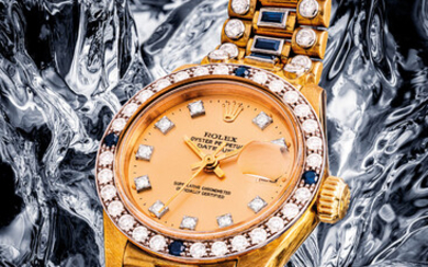 ROLEX. AN IMPRESSIVE AND VERY RARE LADY’S 18K GOLD, DIAMOND AND SAPPHIRE-SET AUTOMATIC WRISTWATCH WITH SWEEP CENTRE SECONDS, DATE AND BRACELET