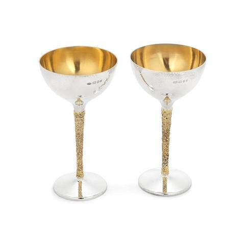 STUART DEVLIN: two silver and silver-gilt coupes/flutes