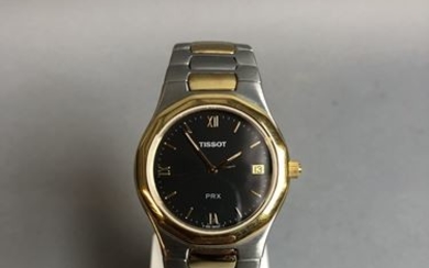 TISSOT PRX men's watch with two-tone steel case...