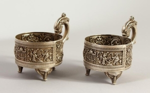 TWO CHINESE SILVER CUP HOLDERS. 9.5cms high.