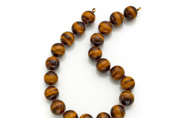 Tiger's eye mm 20/20.50 circa bead necklace with yellow gold details, g 249.24 circa, length cm 48.50 circa. (defects and...