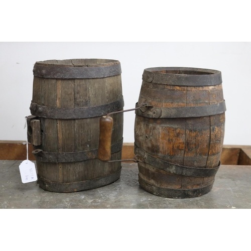 Two antique metal banded oak barrels, approx 24cm H x 19cm W...