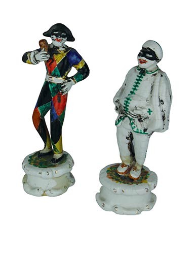 Two small statues Two male masks in multicoloured dresses in...