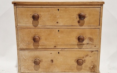Victorian pine chest of three long drawers, each with turned...