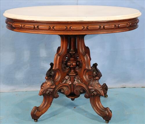 Walnut Victorian oval center table by T. Brooks