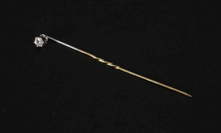 White-gold tie needle with solitaire diamond.