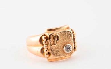 Yellow gold (750) signet ring, P. ciphered, and set with a small brilliant-cut diamond in a closed setting.