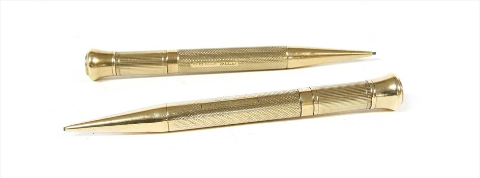 A pair of 9ct gold propelling pencils