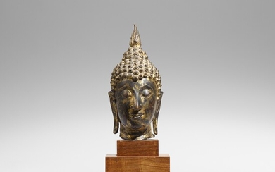 A Sukhothai bronze head of a Buddha. Ca. 14th century
