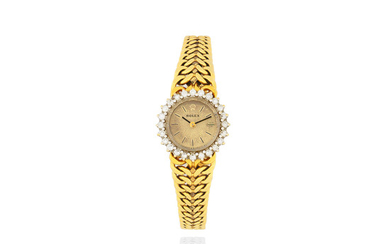 Rolex. A lady's 18K gold and diamond set manual wind bracelet watch