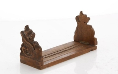 Set of Baroque style walnut bookslide bookends