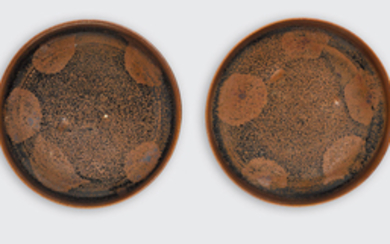 Two small black glazed dishes of Cizhou type with russet splashes and silvery flecks