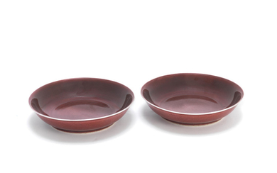 A pair of copper red-glazed dishes