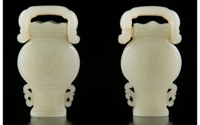 78069: A Pair of Chinese White Jade Vasiform Buckles, Q