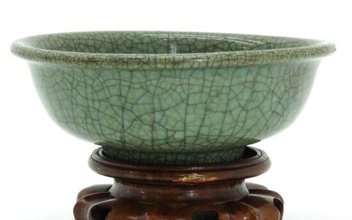 A Celadon Bowl on Carved Wood Base