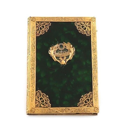 A 19th century French gilt metal mounted aide memoire, rectangular form, the mounts with foliate scroll decoration, green lacquered body mounted ~Souvenir~, with a stylus with a sword hilt handle, length 9.7cm.