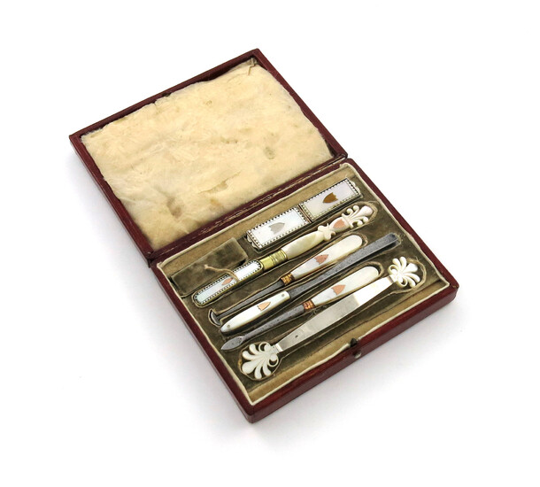 A 19th century French silver and silver-gilt mounted mother-of-pearl dental set