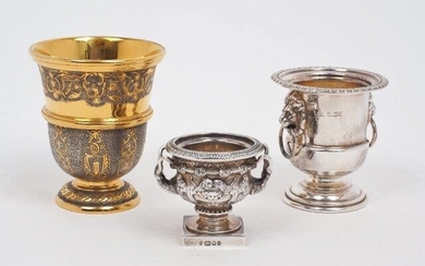 A 20th century Mexican beaker by Tane, stamped 925, the gilded body chased with scroll, bird and rabbit motifs, together with a miniature silver model of the Warwick Vase, London, 1989, Edward Barnard & Sons, 5.3cm high, and a further vase-shaped...