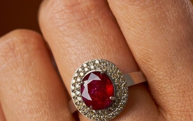A 2.52 CARAT BURMA NO HEAT RUBY AND DIAMOND RING in 18ct white gold, set with an oval cut ruby of